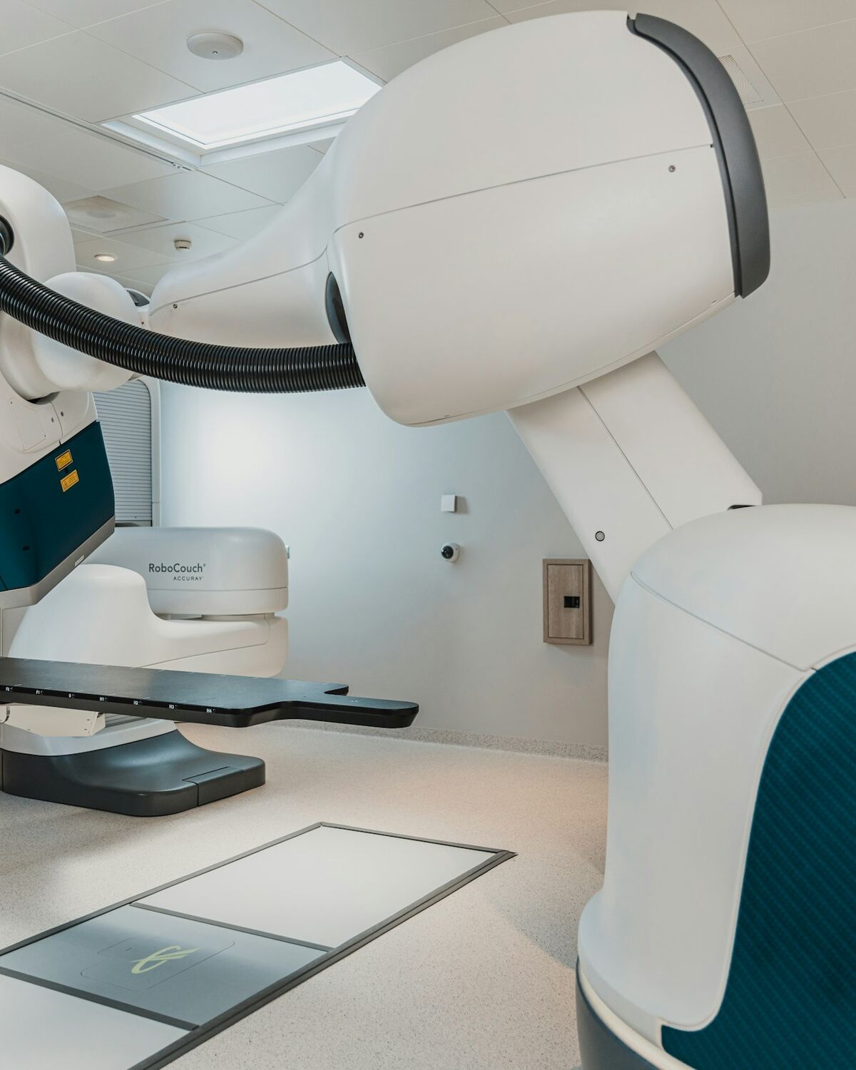 A radiotherapy treatment device in a clinical suite